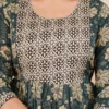 Front close-up of green floral cotton feeding kurti with geometric printed yoke and hidden nursing zip.