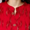 Close-up of neckline, buttons and printed rayon fabric on premium feeding kurti.